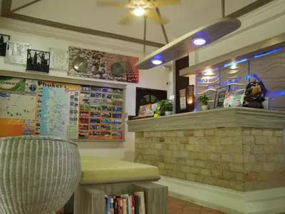 a restaurant with a counter and a table and a chair at Bangtao Beach Chalet Resort in Bang Tao Beach
