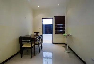 a dining room with a table and chairs at Villa With Pool in Bang Tao Beach
