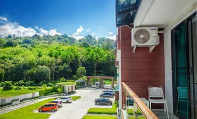 a balcony with cars parked in a parking lot at The Nai Thon Condominium Unit in Nai Thon Beach