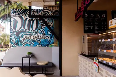 a donut bakery with a sign on the wall at Sleeper Hostel in Ao Nang Beach