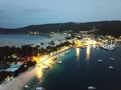 a view of a harbor at night with boats in the water at Natacha Hotel in Phi Phi Don