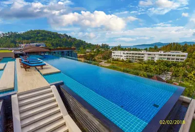 a large swimming pool on the roof of a building at 1-BR Sea View, Aristo condo, Surin Beach in Surin Beach