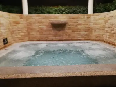 a hot tub in a brick wall at Phuket Riviera Villas Hotel in Nai Harn Beach