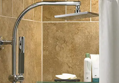 a bathroom with a shower with a shower head at The Shades Hotel 50 meter Beach Front in Patong Beach