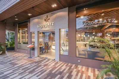 a store front of a restaurant with glass windows at Royal Phuket City Hotel in Phuket Town