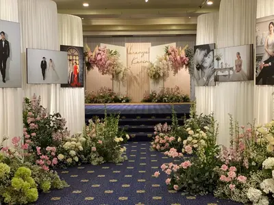 a room filled with lots of flowers and pictures at Royal Phuket City Hotel in Phuket Town