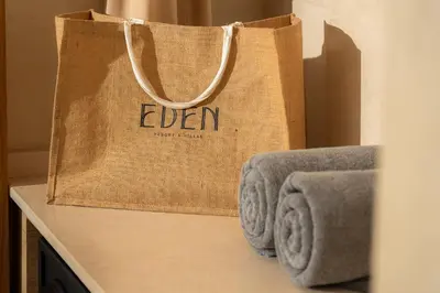 a brown bag sitting on top of a counter with towels at Eden Resort & Villas Phuket Patong in Patong Beach