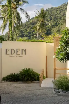 a sign for the elan hotel and villas at Eden Resort & Villas Phuket Patong in Patong Beach