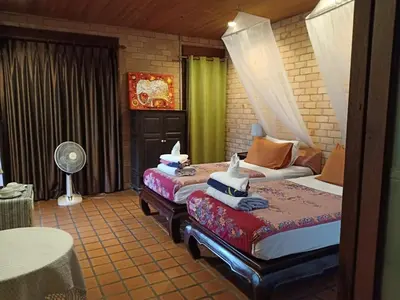 a hotel room with two beds and a fan at Sea Pines & Liberg in Nai Yang Beach
