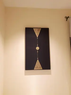 a picture of a clock hanging on a wall at Classic home in Bang Tao Beach