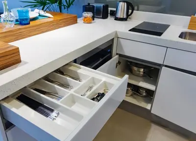 a kitchen with a white counter top with an open drawer at Oceanstone by Holy Cow, 1-BR, next building view in Bang Tao Beach