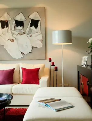 a living room with a white couch and a table at Two Villas HOLIDAY - ONYX Style Naiharn Beach, Phuket in Nai Harn Beach