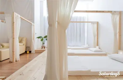 two beds in a room with white curtains at Two Villas HOLIDAY - ONYX Style Naiharn Beach, Phuket in Nai Harn Beach