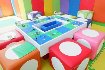 a lego play room with a table and chairs at Grand Kata VIP - Kata Beach in Kata Beach
