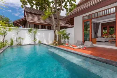 a swimming pool in the backyard of a villa at L'esprit De Naiyang Beach Resort - SHA Extra Plus in Nai Yang Beach