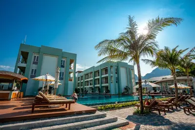 a resort with a swimming pool and a palm tree at Phi Phi Harbour View Hotel in Phi Phi Don