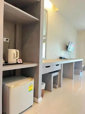 an office with a desk with a coffee maker on it at Phuketa Hotel Phuket Town in Phuket Town