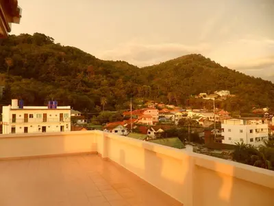a balcony with a view of a mountain at G&B Guesthouse in Patong Beach