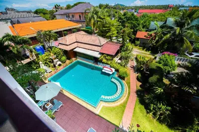 an aerial view of a house with a swimming pool at Phuket Monaburi Boutique Hotel in Rawai Beach