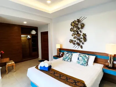 a bedroom with a bed in a room at Cozy Two Bedrooms Villa by G Estate in Rawai Beach