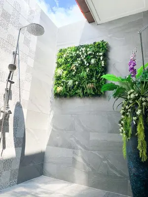 a bathroom with a plant on the wall at Cozy Two Bedrooms Villa by G Estate in Rawai Beach