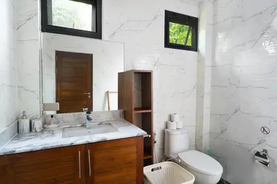 a bathroom with a sink and a toilet at Nenuphar Villa by G Estate in Rawai Beach
