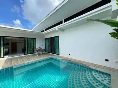 an indoor swimming pool in a villa at Skypool Villa by G Estate Phuket in Nai Harn Beach