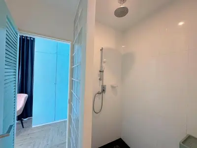 a bathroom with a shower with a glass door at Peaceful Bliss in 81sqm Top Floor in Kamala in Kamala Beach