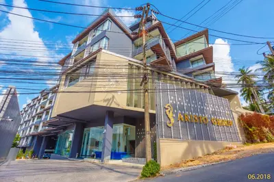 a building on the corner of a street at The Aristo Beach by Holy Cow, studio, without kitchen, construction view in Surin Beach