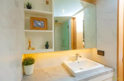 a bathroom with a sink and a mirror at The Aristo Beach by Holy Cow, studio, without kitchen, construction view in Surin Beach