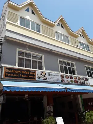 a building with a sign that reads southern fried rice restaurant and guest house at Southern Fried Rice in Kata Beach