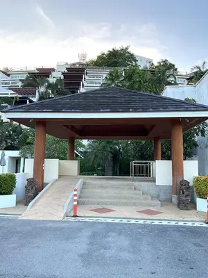 a pavilion with a black roof in a parking lot at Bel Air Cape Panwa Resort Phuket in Panwa Beach