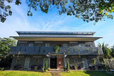 a building with a solarium on top of it at Phuket Nonnita Boutique Resort - SHA Plus in Phuket Town