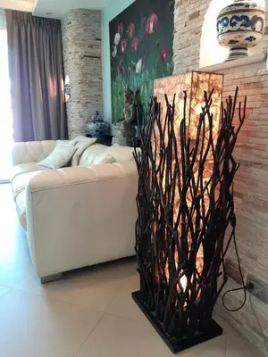 a living room with a white couch and a brick wall at Karon Beach Apartment Sea View in Karon Beach