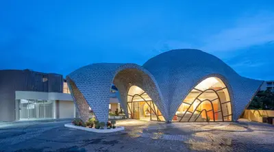 a building with a geometric patterned facade at Metadee Concept Hotel in Kata Beach