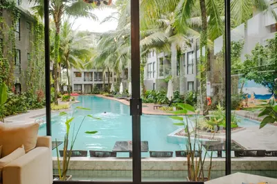 a view of a swimming pool from a hotel room at Diamond Resort Phuket Official Account in Bang Tao Beach