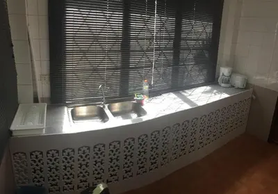 a kitchen window with a sink and a window sill at Villa Kamala Beach in Kamala Beach