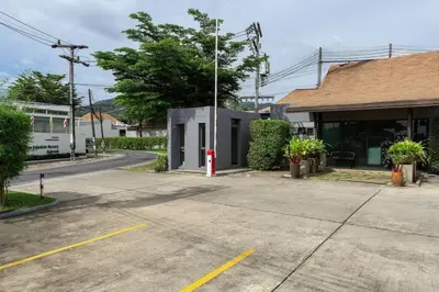 an empty parking lot in front of a building at VILLA ARU Private Pool 3 min to Naiharn Beach in Nai Harn Beach