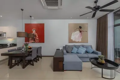 a living room with a couch and a table at VILLA ARU Private Pool 3 min to Naiharn Beach in Nai Harn Beach
