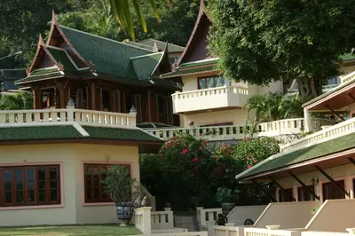 a large house with a green roof at Prince Edouard Apartments & Resort Patong Beach Phuket in Patong Beach
