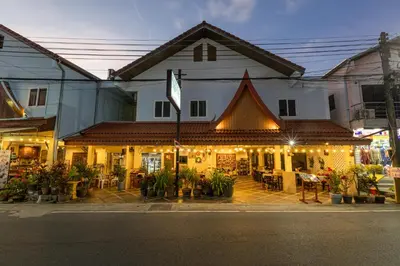 a building with lights on the side of a street at Kamala Dreams in Kamala Beach