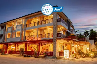 a building with a sign in front of it at The Orchid House - SHA Extra Plus in Kata Beach