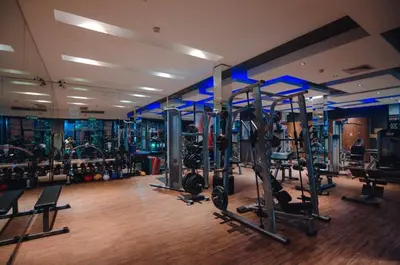 a gym with a bunch of treadms and machines at C & N Resort and Spa - SHA Extra Plus in Patong Beach