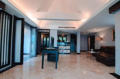 a living room with a couch and a table at C & N Resort and Spa - SHA Extra Plus in Patong Beach