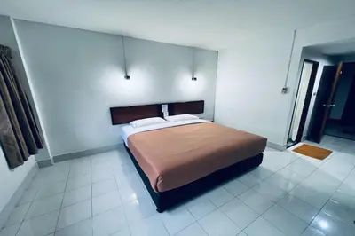 a bedroom with a large bed in a room at Pure Phuket Residence in Phuket Town