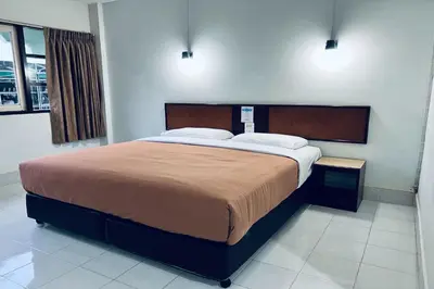 a bedroom with a large bed in a room at Pure Phuket Residence in Phuket Town