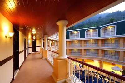a balcony of a hotel with a swimming pool at Kalim Resort in Patong Beach