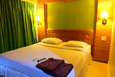a bedroom with a bed with two towels on it at Aonang Top View in Ao Nang Beach