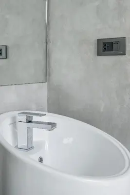 a white bath tub with a sink and a mirror at Woodpecker Villa - Kamala Beach in Kamala Beach