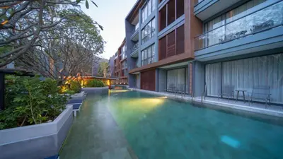 a swimming pool in the middle of a building at The Nature Phuket in Patong Beach